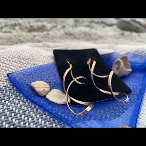 Gold tone twisted dangle pierced earrings